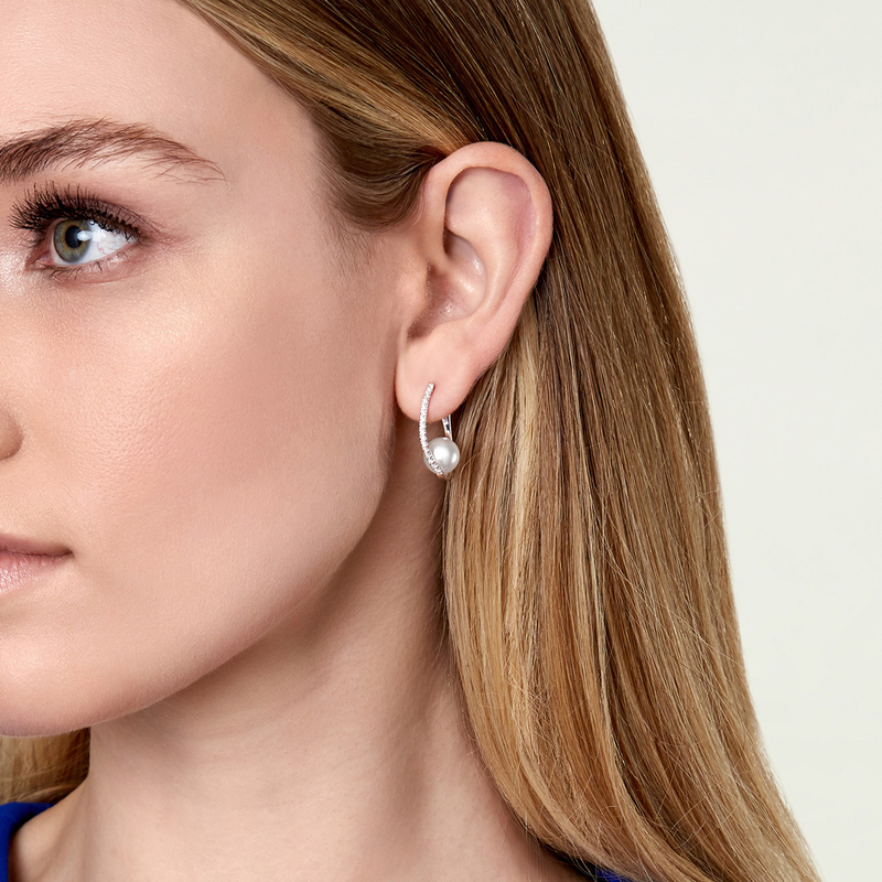 Model is wearing Eliza earrings with 9mm AAAA quality pearls