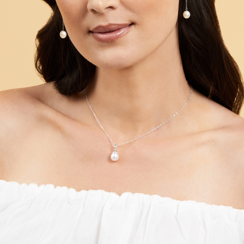 Model is wearing Devon Pendant with 9-10mm AAAA quality pearls