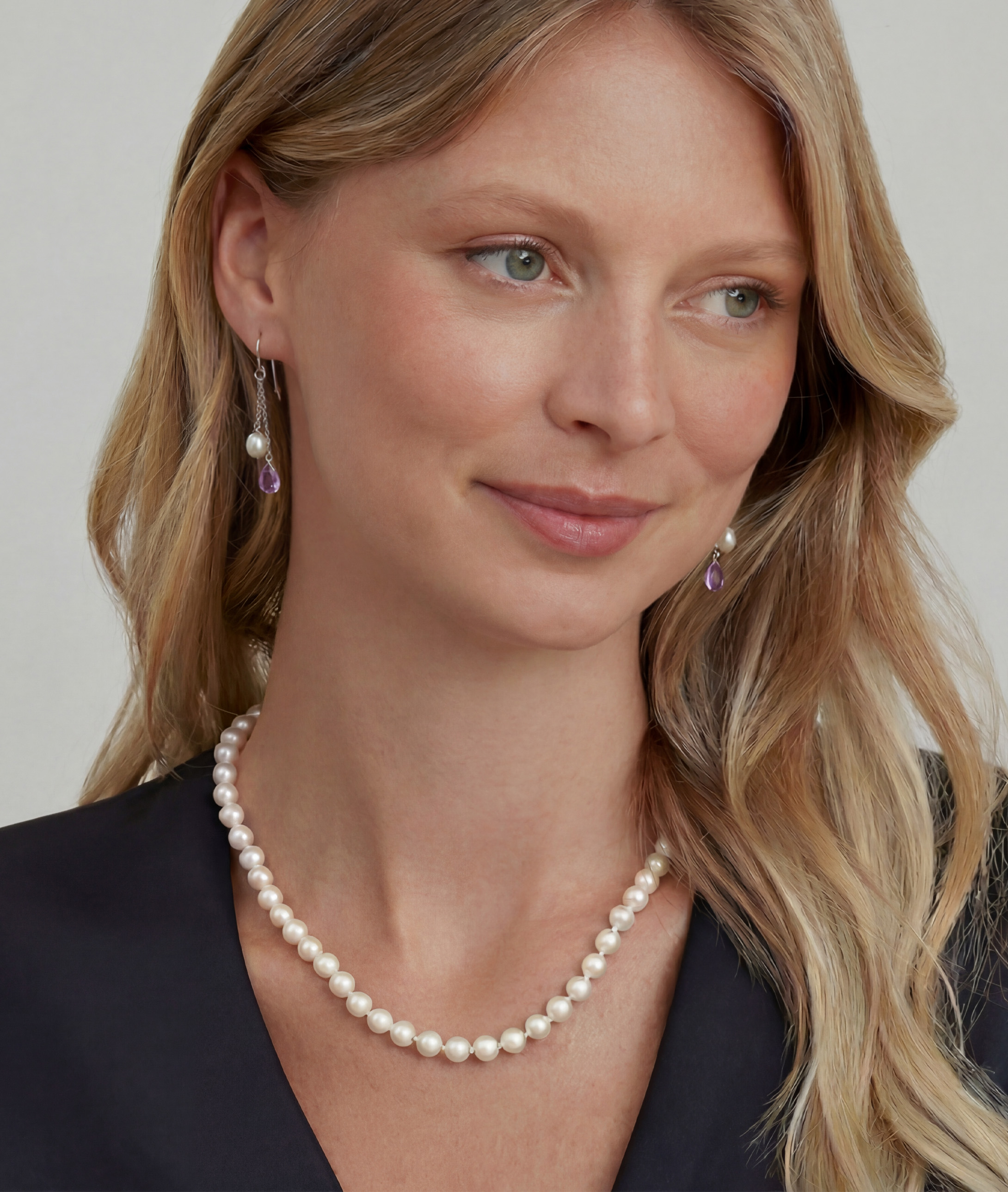 White Freshwater Drop Shape Cultured Pearl & amethyst Earrings - Model Image